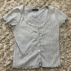 Blue and white flowered short sleeve with a low neck line